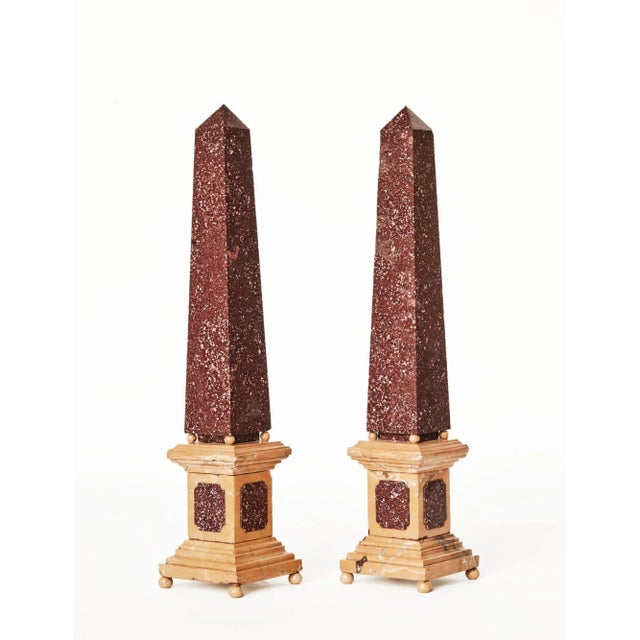 The porphyry obelisks on sienna 'marmo giallo' and porphyry base, condition: 2 small cracks on 1 base and a repair to the...