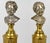 Pair of parcel-gilt bronze heads of crying babies on fluted bronze doré columns after Jean-Antoine Houdon. They have been...