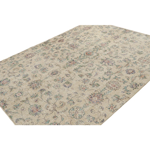 Hand Knotted in wool circa 1960-1970, this 6x8 vintage rug is believed to be among the transitional designs of mid-century...