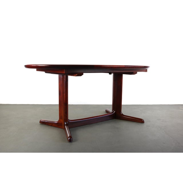 Vintage Dyrlund Danish Modern Rosewood stained Dining Table! This dramatic table features a gorgeous and highly figured...