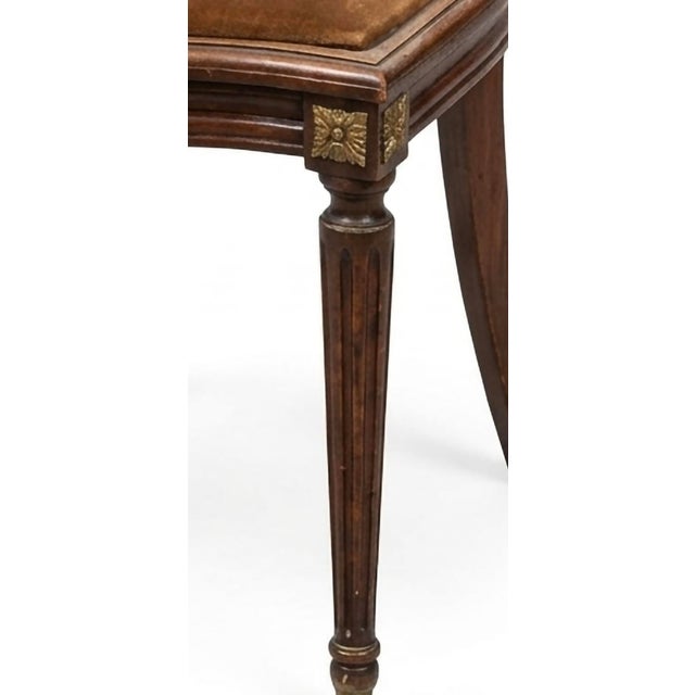 This Louis XVI period side chair is an iconic example of late 18th-century French neoclassicism, specifically known as a...