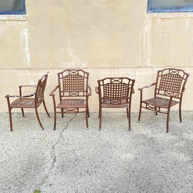 Hollywood Regency Style Cast Aluminum Basket Weave Lattice Rattan Patio Outdoor Arm Chairs - Set of 4. Item features...