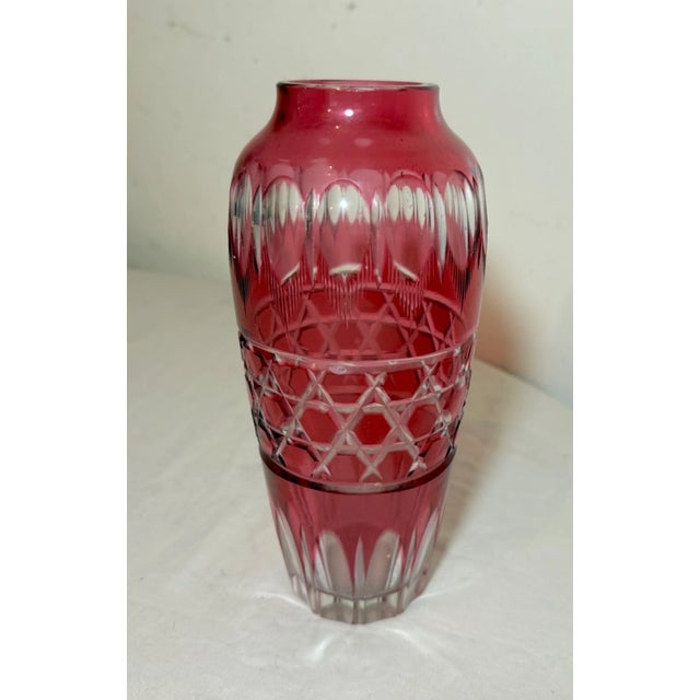 This lovely crystal example features a vibrant cranberry red color done in cut to clear style with intricate design...