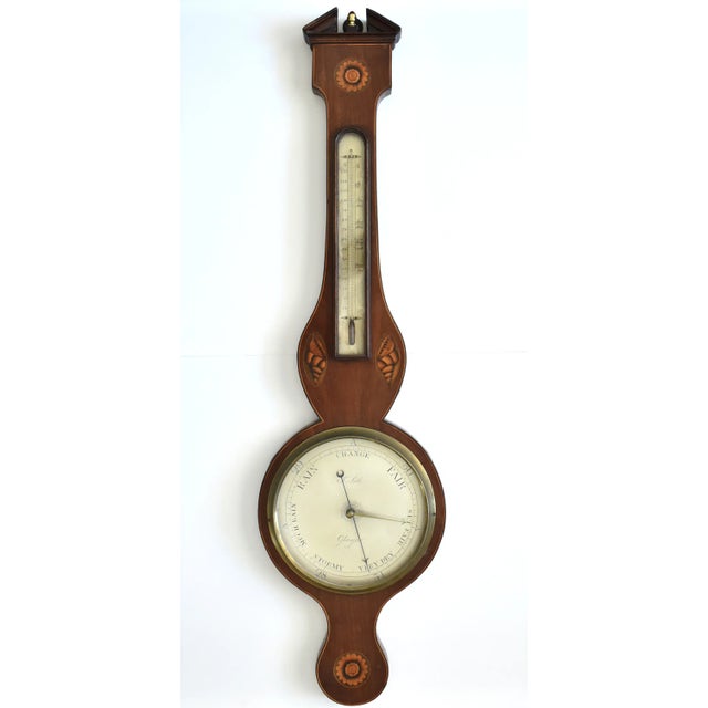 An antique, Regency or Georgian, early 19th-century c. 1810-1830 Scottish wall-mount wheel barometer with a silvered round...
