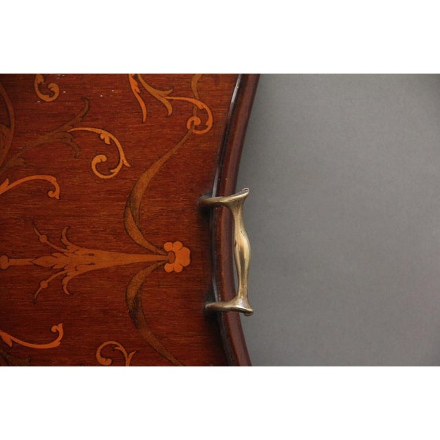 A lovely quality 19th Century inlaid mahogany tray, having a shaped gallery edge with brass carrying handles either end,...