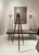 A striking early 20th-century surveyor’s tripod, thoughtfully converted into a sculptural floor lamp. This piece retains...