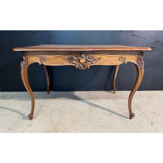 A lovely French Rococo Writing Desk or Table dating to the late 19th Century. Made from Walnut and having a single drawer...