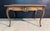 A lovely French Rococo Writing Desk or Table dating to the late 19th Century. Made from Walnut and having a single drawer...