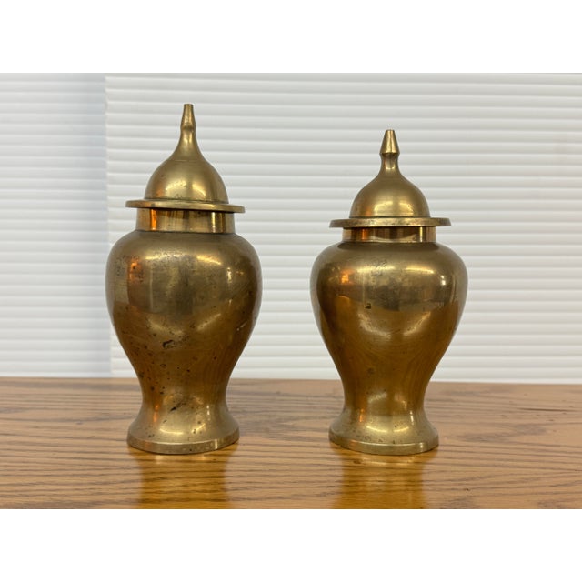Design Plus Gallery presents a Set of Two Ginger Jar Vessels with Lids in Brass. This impactful duo will brighten any...