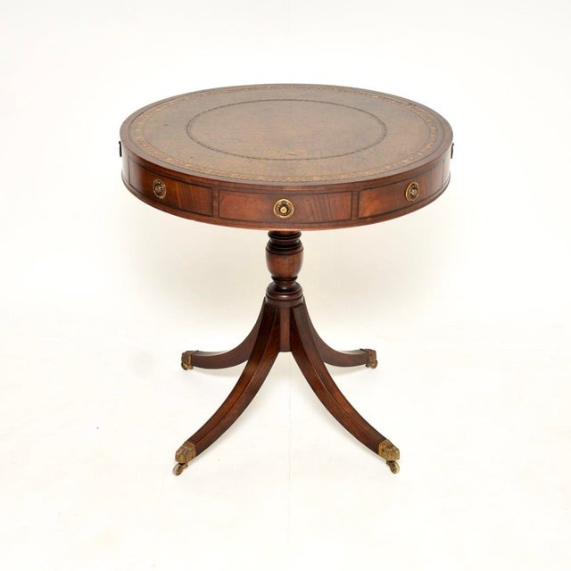 A lovely antique Regency style leather top drum table, dating from around the 1890-1910 period. The quality is superb,...