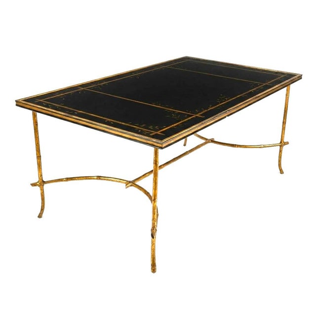 Rare signed Dennis & Leen rectangular cocktail table that features black lacquer top, hand forged iron bamboo style base...