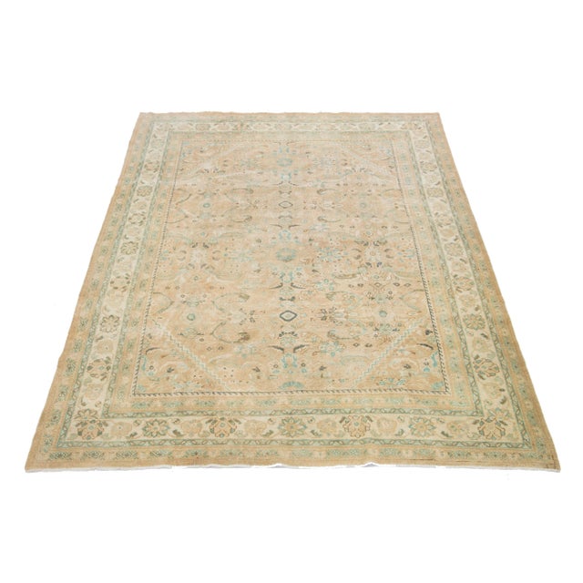 Beautiful Vintage Mahal hand-knotted wool rug with a beige color field. This Persian rug has classic green and gray hues...