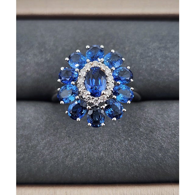 This exquisite cocktail ring is a stunning display of luxury and craftsmanship, designed to captivate with its brilliance...