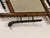 A natural bamboo wall mirror, imbued with the delicate charm of late 19th-century Japonisme. Its square, diamond-shaped...