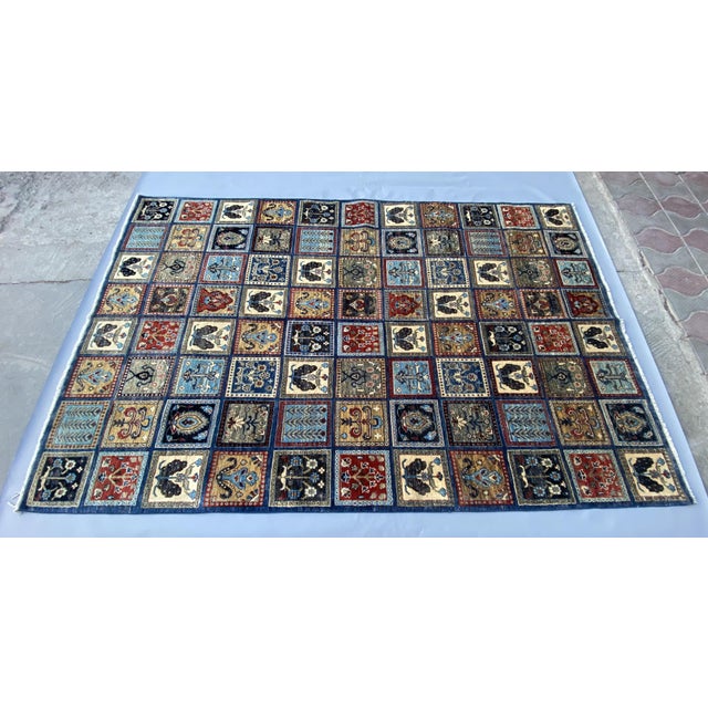This handmade rug from Afghanistan features a striking Garden Panel (Kheshti) design, inspired by traditional Persian...