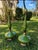 Beautiful pair of vintage table lamps featuring glossy green glazed ceramic and bronze/gold-tone metal details. Elegant...