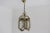 Bring romance into your home with this elegant French Louis XVI style hanging lantern from the 1950s. The finely cast...
