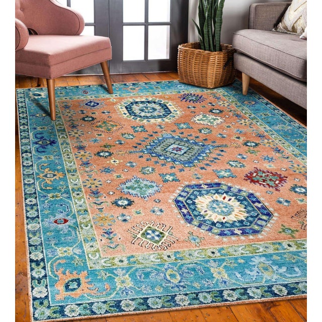 Ava Kazak Coral Hand Knotted Wool Rug, Country of Origin: India. This exquisite piece showcases the enduring quality of...