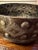 Signed Handsome, rugged, hammered highly decorative metal centerpiece bowl by Desulme Brutus. Has two large rings on...