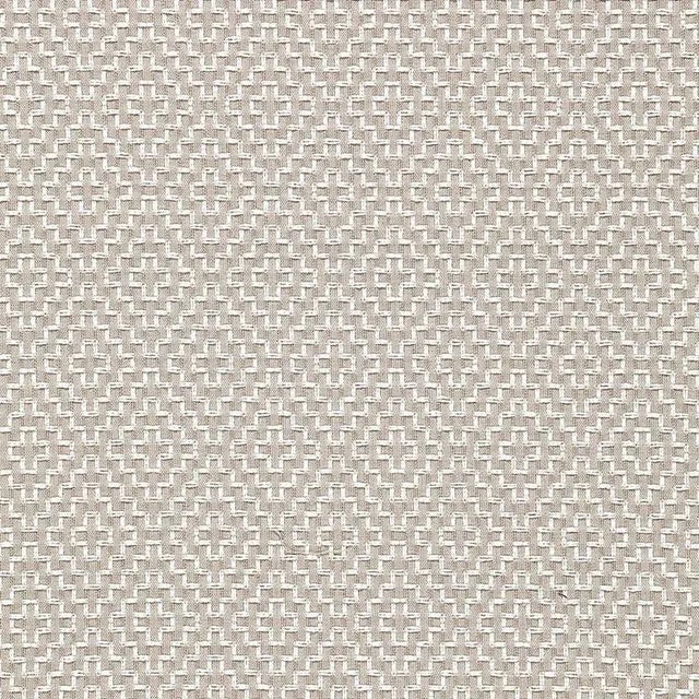 With its nuanced tonal variations and cross-stitch pattern, this graphic fabric has the appeal of a handcrafted textile....