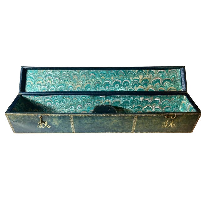 A fine George III period scroll box covered in richly gilt-embossed leather, retaining its original form and decorative...