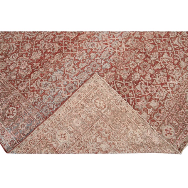 Beautiful antique Mahal hand-knotted wool rug with a red field. This Mahal rug has a brown frame Ivory, brown, and blue...