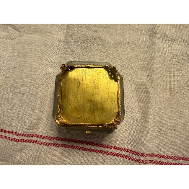 Elegant and timeless, this antique French jewelry casket features beautifully beveled glass panels set within a warm brass...