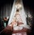 Hello There 1961 Film star Diana Dors (Diana Fluck) (1931 – 1984) in blonde bombshell pose on a satin covered bed. Slim...
