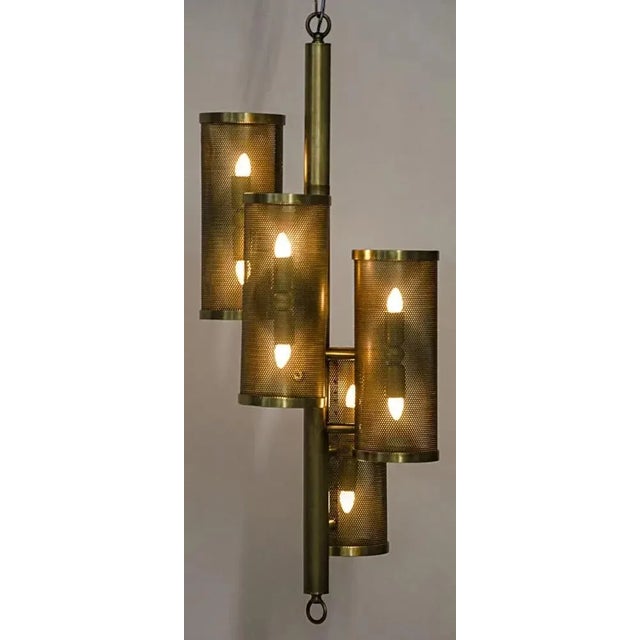 This elegantly angled metal floor lamp has been expertly artisan crafted and finished in antique brass. Its classic lines...