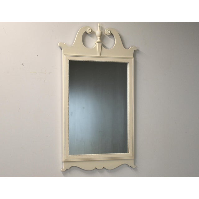A painted white chippendale style mirror. Circa 1950’s. Verry good condition. Made in USA. 25.25” wide. 44” tall.