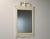 A painted white chippendale style mirror. Circa 1950’s. Verry good condition. Made in USA. 25.25” wide. 44” tall.