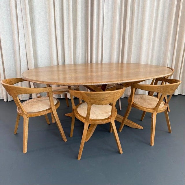 This striking late mid 20th century, artisan made dining set captures the warmth and fluidity of Scandinavian and organic...