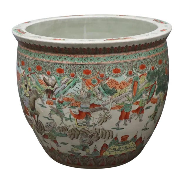 These Chinese Famille Verte fishbowl planters feature richly detailed hand-painted scenes with vibrant figures,...