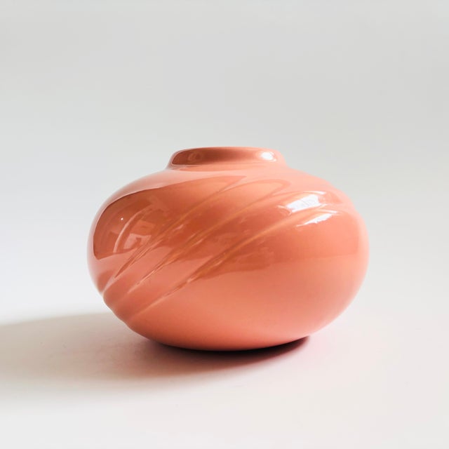 A vintage 1980s ceramic vase. Light pink glaze with diagonal embossed detailing. Non-glazed interior, suitable for dried...