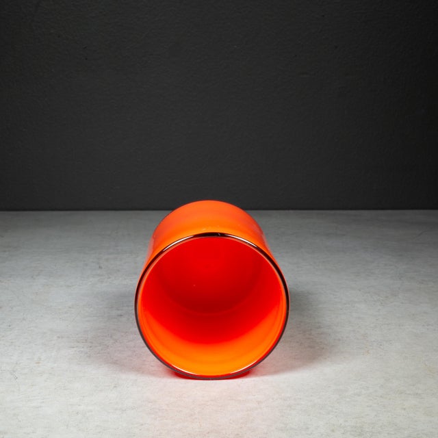 ABOUT Small cylindrical vibrant orange glass vase with black rim. CREATOR Unsigned. Possibly Murano. DATE OF MANUFACTURE...