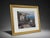 Elegant framed coastal landscape artwork featuring a seaside villa, garden patio, ocean view, mountains, and...