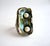 Modernist freshwater two pearl ring set in an abalone shell face created by jewelry artist Ursula Hammil. Rings face...