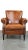 This is a refined and comfortable sheepskin leather armchair/fauteuil with a beautiful finish, featuring a loose seat...