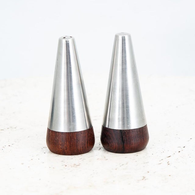 Unique Danish Rosewood and Stainless steel salt and pepper shakers. Well made pieces that are signed beneath. Great...