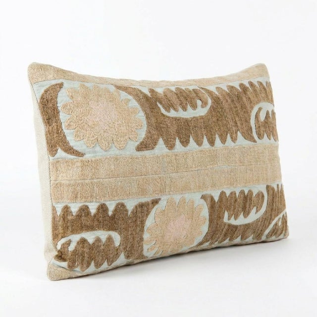 This beautiful 16'' x 22'' hand-embroidered Suzani pillow cover was made from authentic Uzbek cotton fabric. The intricate...