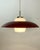 Danish mid-century pendant attributed to Bent Karlby, Denmark, circa 1950s–1960s. Executed in lacquered metal with a...