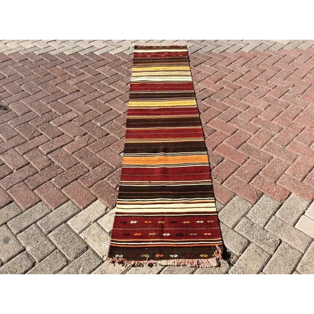 This beautiful, vintage, handwoven kilim is approximately 60 years old. It is handmade, of very fine quality hand spun...