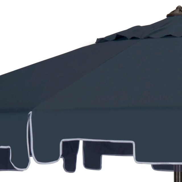 The navy blue market umbrella gets a chic makeover with the addition of a for extra sun protection and European flair....