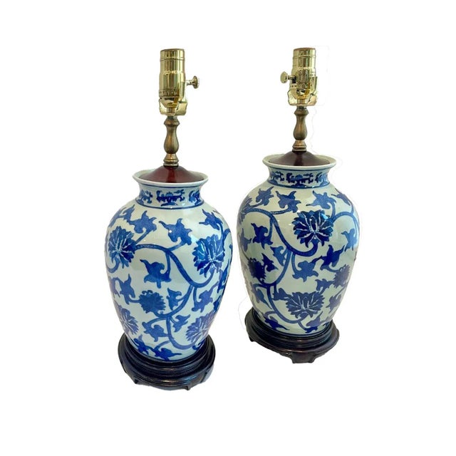Set of two late 18th century blue and off-white Chinoiserie porcelain plum jars that have been converted into a pair of...