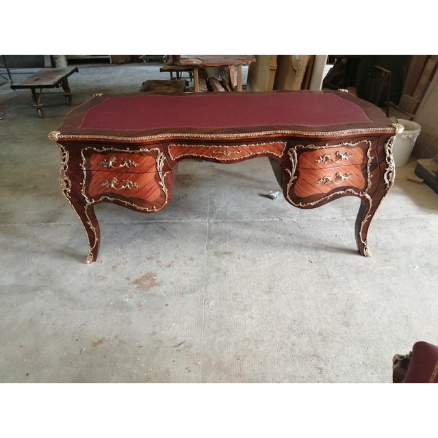 Handcrafted in Italy, this Louis XV writing desk features rosewood veneers, a shaped silhouette, and decorative solid...