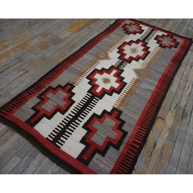 Antique Navajo Native American Flat Weave Rug sophisticated, Circa Date: 1920s. This exceptional example of early 20th-...