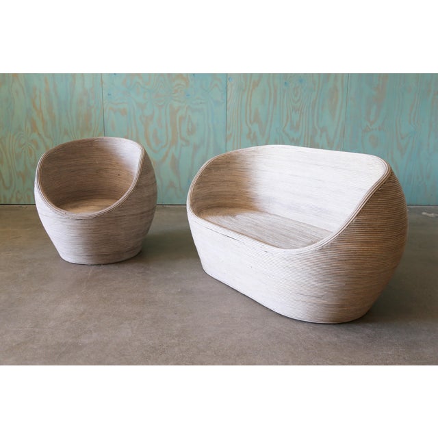 A set of split reed bamboo sofa and chair. An organic bulbous shape, these are pleasing form every angle. The chairs were...