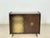 Stylish mid-century bar cabinet from the 1960s with an integrated record player. The piece impresses with its compact...