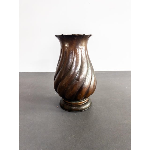 Striking hand-hammered copper floor vase with an elegant twisted design, made in Italy and stamped Made in Italy. Likely...