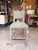 Contemporary counter stool featuring clean lines and a tailored silhouette upholstered in a soft green woven fabric. The...